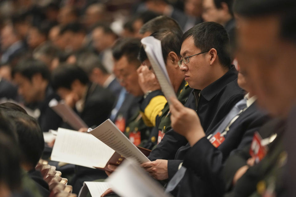 Delegates attend the second plenary session meeting of the National People's Congress (NPC) in the Great Hall of the People in Beijing, China, Friday, March 8, 2024. (AP Photo/Tatan Syuflana).