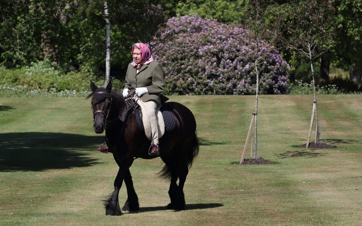 The Queen riding Balmoral Fern, her 14-year-old pony, in Windsor Home Park - PA