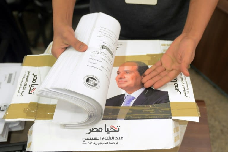 Campaign staff of President Abdel Fattah al-Sisi, who has ruled Egypt with an iron fist since being elected in 2014, check boxes containing signatures needed to register for the March 26-28 election
