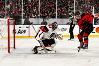 New Jersey Devils right wing Nathan Bastian, right, shoots against Philadelphia Flyers goaltender Samuel Ersson (33) in the first period of an NHL Stadium Series hockey game in East Rutherford, N.J., Saturday, Feb. 17, 2024. (AP Photo/Peter K. Afriyie)