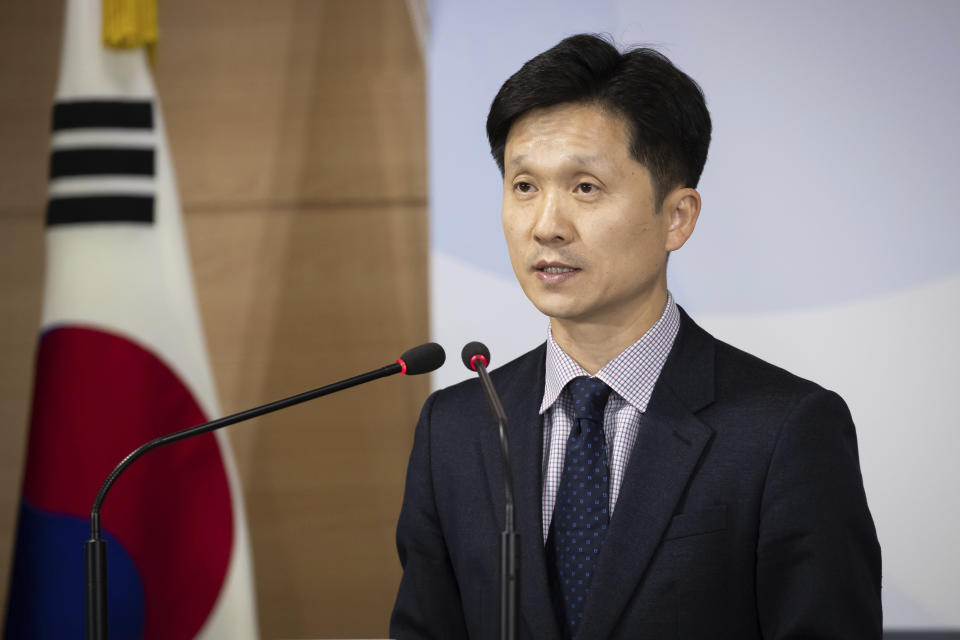 South Korean Unification Ministry spokesman Lee Sang-min briefs the media at a government complex in downtown Seoul, South Korea, Thursday, Nov. 7, 2019. South Korea says it has deported 2 North Koreans after finding they had killed 16 fellow fishermen onboard and fled to South Korea. (Kim Seung-doo/Yonhap via AP)