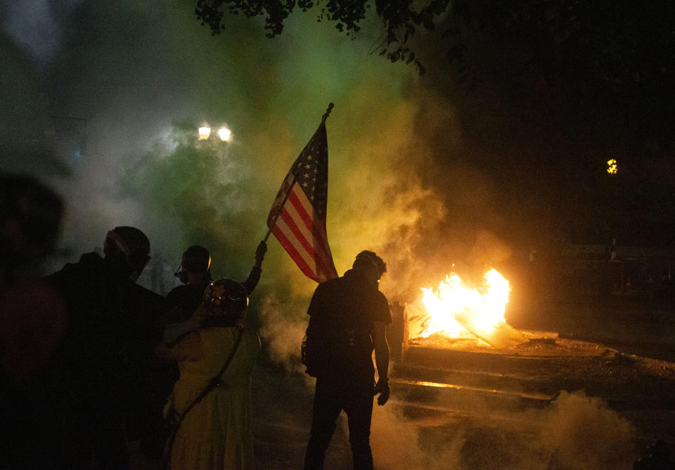 Tear gas and crowd munitions were deployed by federal police during protests in Portland, Oregon, Tuesday, July 21, 2020. (Beth Nakamura/The Oregonian via AP)
