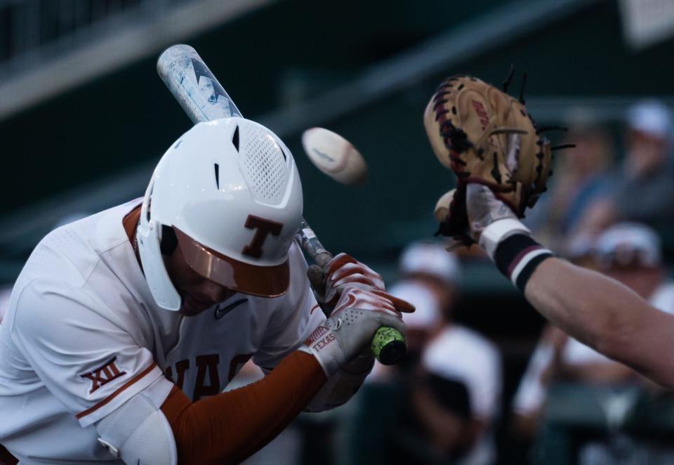 Texas' Eric Kennedy ducks to avoid a pitch while batting in the first inning of Tuesday night's 9-3 loss to Texas State at UFCU Disch-Falk Field. The Longhorns were playing their fifth game in as many days. They went 3-2 against Kansas State and the Bobcats.