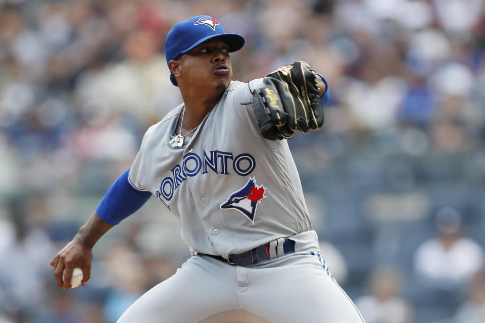 Toronto Blue Jays starting pitcher Marcus Stroman winds up during the first inning of a baseball game against the New York Yankees, Sunday, July 14, 2019, in New York. (AP Photo/Kathy Willens)