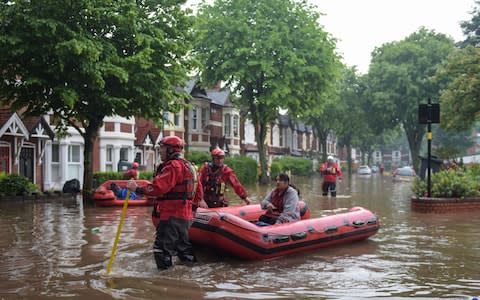 Residents on Sir Johns Road in Selly Oak, Birmingham had to be rescued by firefighters using boats - Credit:  Michael Scott/Caters News