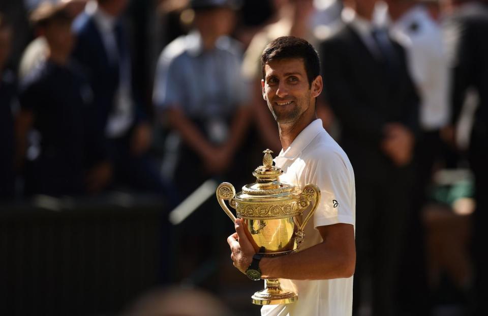 True champion: Djokovic celebrates a fourth Wimbledon crown (AFP/Getty Images)