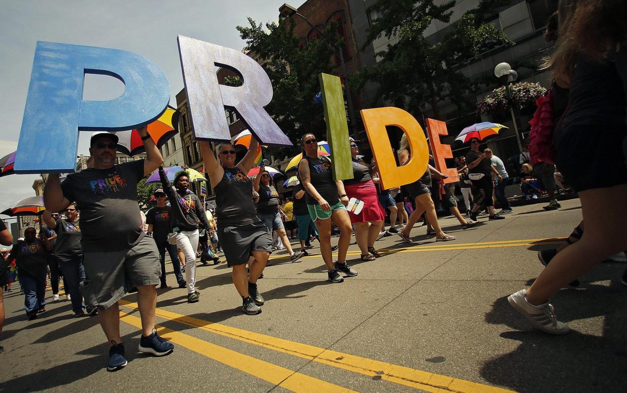 A group from OhioHealth heads down High Street during the 2019 Stonewall Columbus Pride Parade. This year's march will take place June 18.