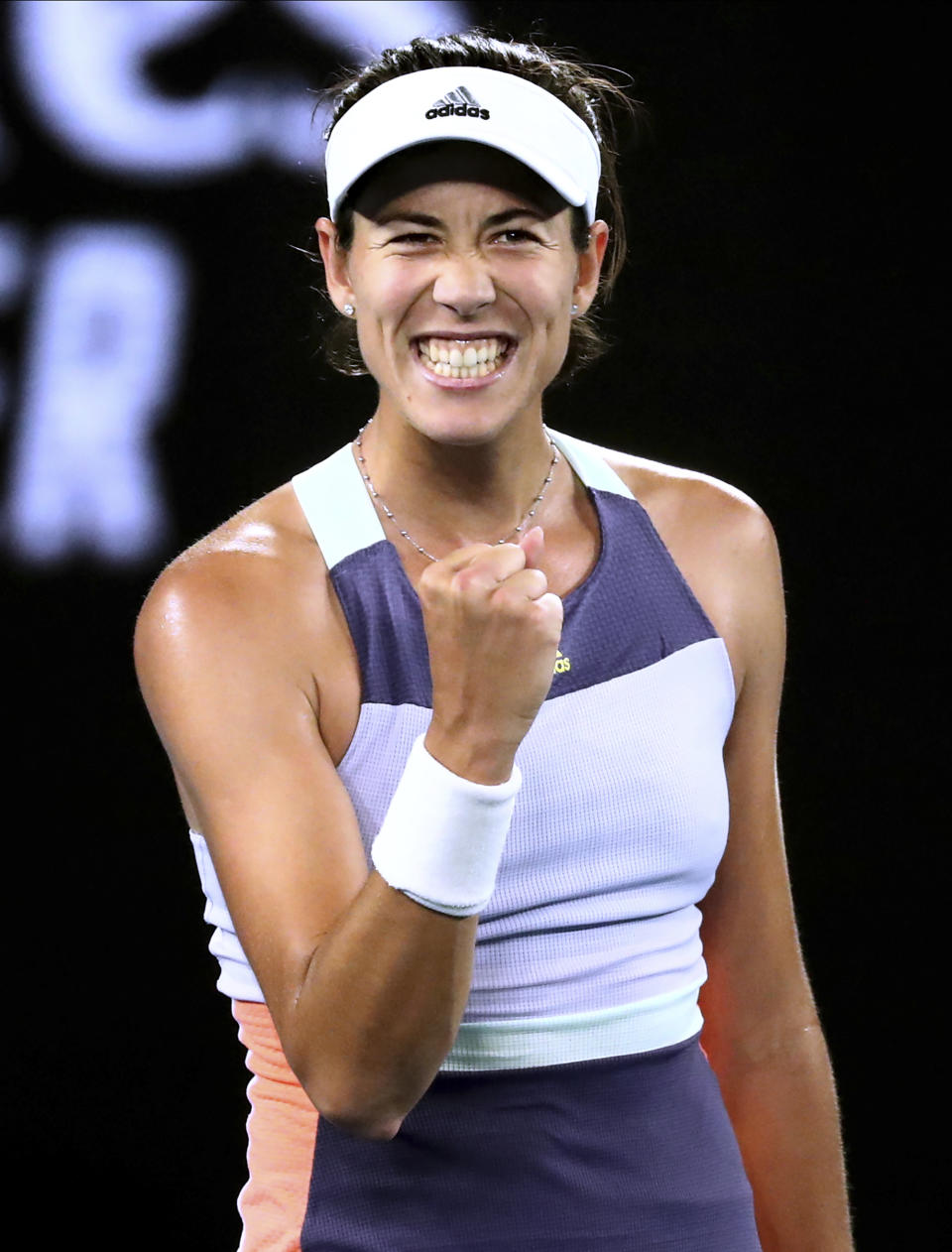 Spain's Garbine Muguruza reacts after defeating Australia's Ajla Tomljanovic in their second round singles match at the Australian Open tennis championship in Melbourne, Australia, Thursday, Jan. 23, 2020. (AP Photo/Dita Alangkara)