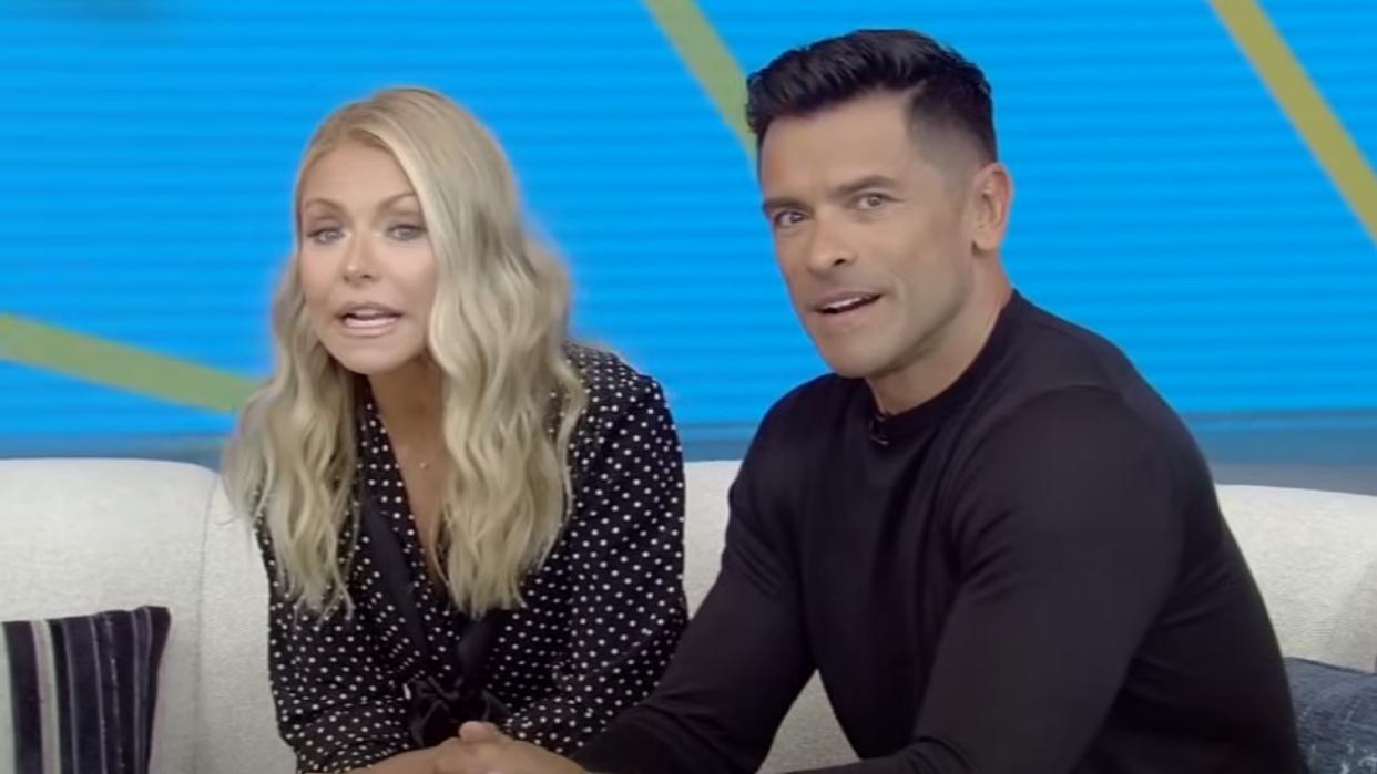  Kelly Ripa and Mark Consuelos on couch hosting Live with Kelly and Mark 