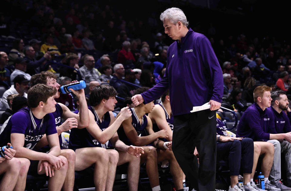 Elder head coach Joe Schoenfeld celebrates with his players after the Panthers district final win over Wayne Sunday March 10, 2024.