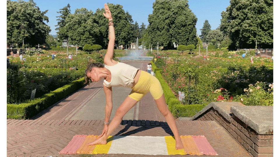 Woman standing on yoga at in Extended Triangle Pose