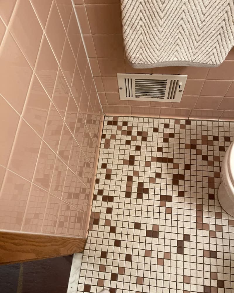 Tile floors in bathroom before renovation.