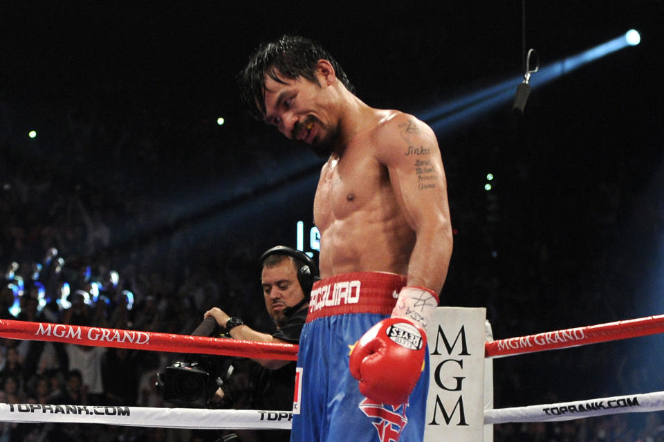 LAS VEGAS, NV - NOVEMBER 12: Manny Pacquiao reacts after the 12th round before it is announced that he won by majority decision against Juan Manuel Marquez in the WBO world welterweight title fight at the MGM Grand Garden Arena on November 12, 2011 in Las Vegas, Nevada. (Photo by Harry How/Getty Images)