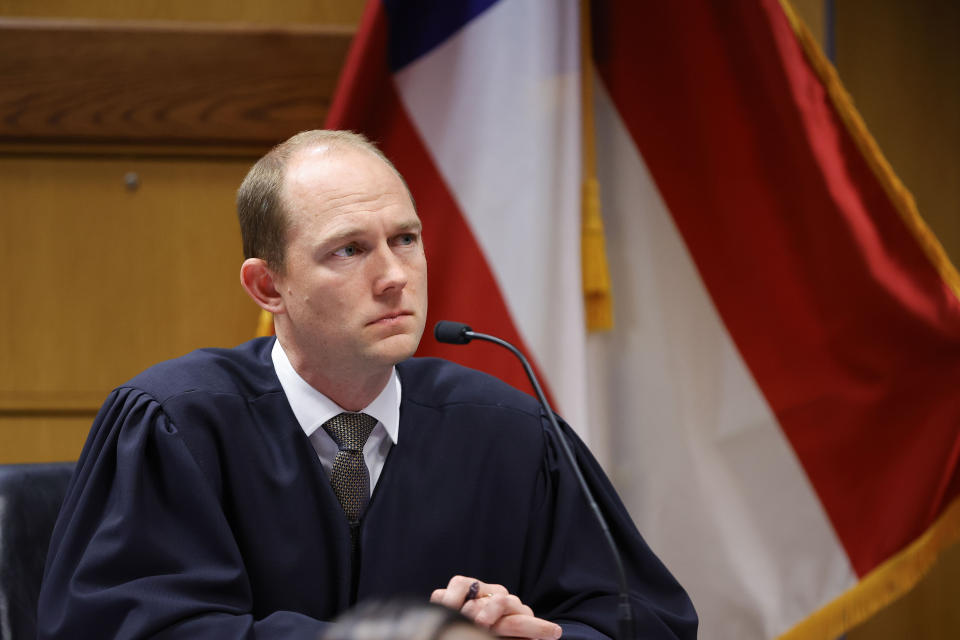Fulton County Superior Judge Scott McAfee presides in court, Friday, March, 1, 2024, in Atlanta. The hearing is to determine whether Fulton County District Attorney Fani Willis should be removed from the case because of a relationship with Nathan Wade, special prosecutor she hired in the election interference case against former President Donald Trump. (AP Photo/Alex Slitz, Pool)
