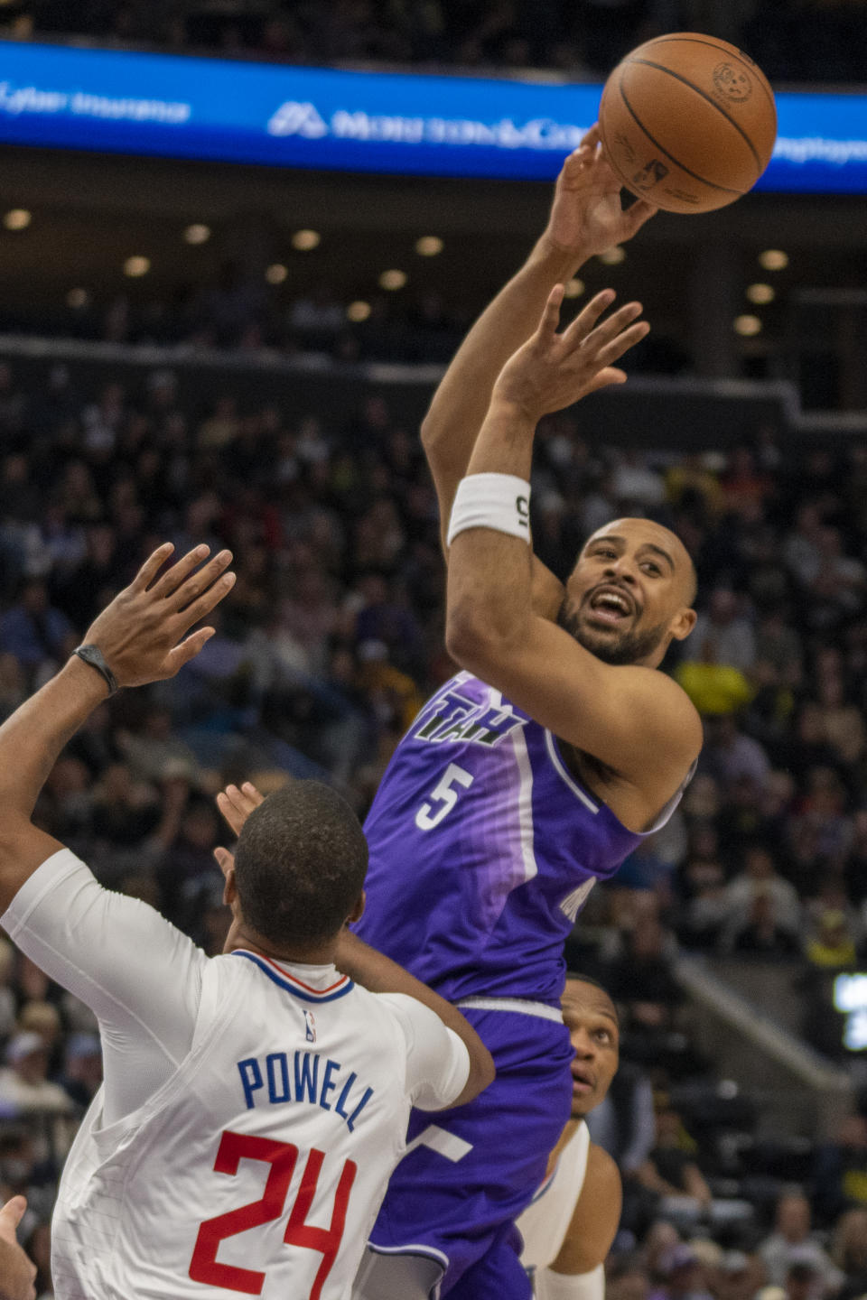 Utah Jazz guard Talen Horton-Tucker (5) passes the ball as Los Angeles Clippers guard Norman Powell (24) defends during the first half of n NBA basketball game Friday, Dec. 8, 2023, in Salt Lake City. (AP Photo/Rick Egan)