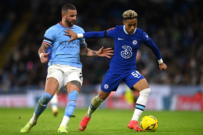 Kyle Walker  battles for possession with Omari Hutchinson