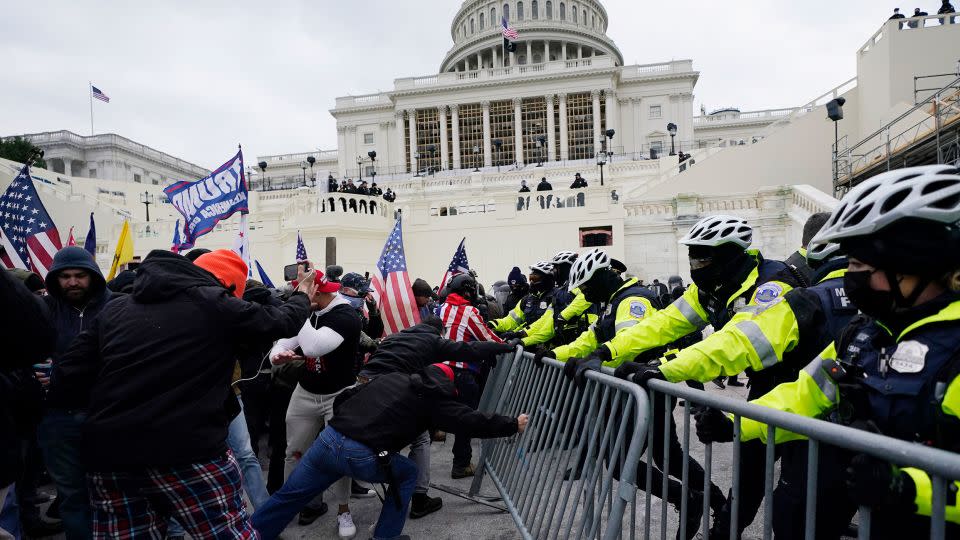 Rioters loyal to President Donald Trump clash with police at the US Capitol in Washington on Jan. 6, 2021. - Julio Cortez/AP