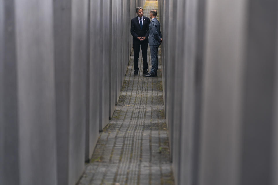 U.S. Secretary of State Antony Blinken, left, and German Minister of Foreign Affairs Heiko Maas, right, speak together as they walk through the Memorial to the Murdered Jews of Europe following a ceremony for the launch of a U.S.-Germany Dialogue on Holocaust Issues in Berlin, Thursday, June 24, 2021. Blinken is on a week long trip in Europe traveling to Germany, France and Italy. (AP Photo/Andrew Harnik, Pool)