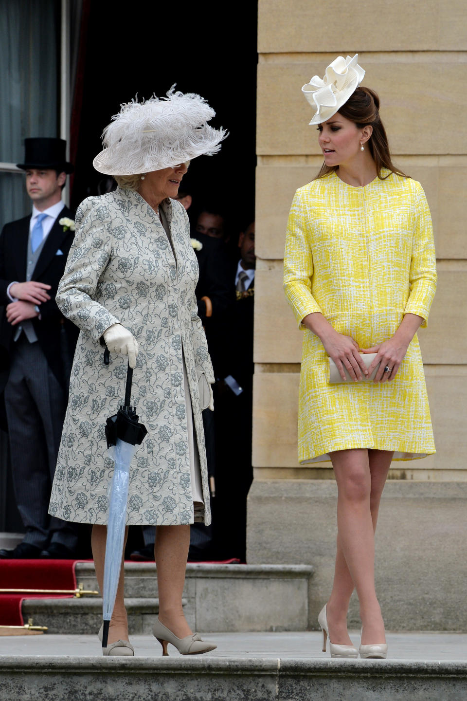 <p>Kate wore a sunny yellow coat by Emilia Wickstead for the Queen’s garden party at Buckingham Palace in May 2013. <em>[Photo: Getty]</em> </p>