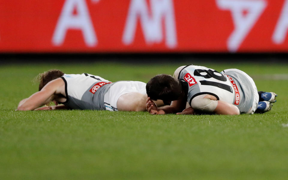 Tom Jonas and Zak Butters, pictured here after colliding during Port Adelaide's loss to Richmond.