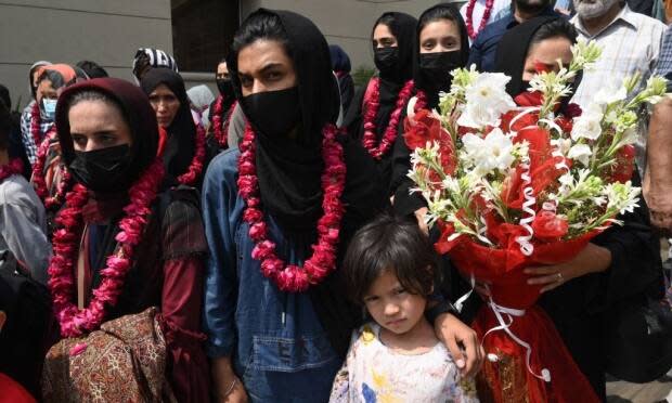 Members of Afghanistan's national junior women's soccer team arrive at the Pakistan Football Federation (PFF) in Lahore on September 15. They fled the country after the Taliban retook power, and banned women from playing all sports.  (Arif Ali/AFP via Getty Images - image credit)