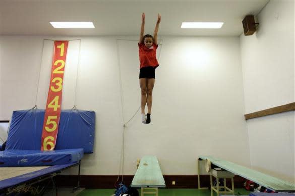 Crystal Palace Diving Club member Victoria Vincent practices during a training session in a dry diving gym in London March 9, 2012.