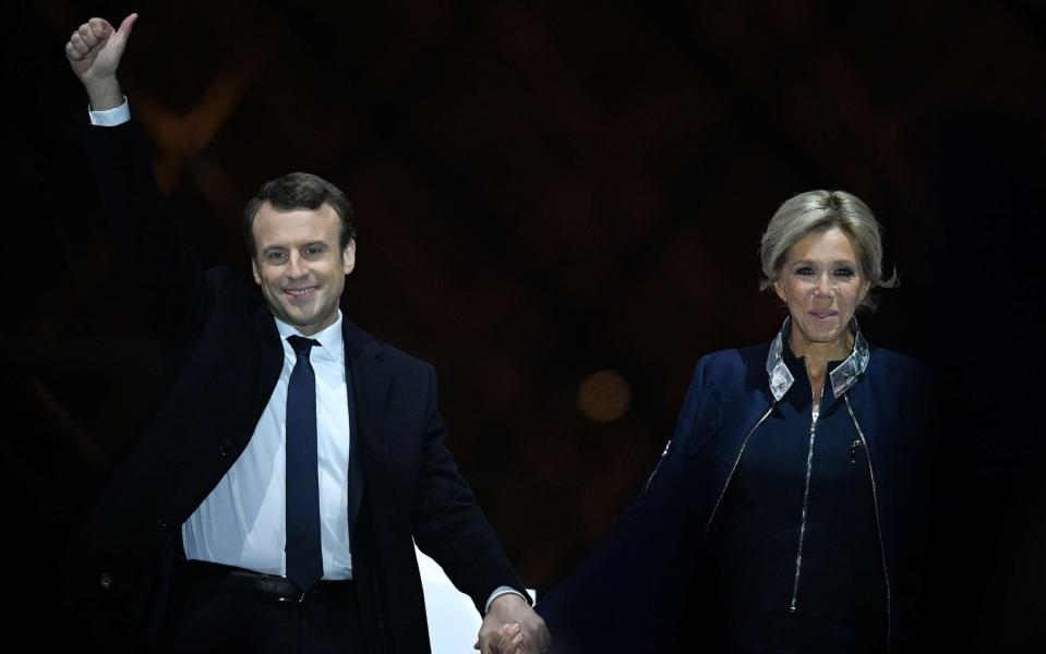 French president-elect Emmanuel Macron and his wife Brigitte Trogneux wave to the crowd in front of the Pyramid at the Louvre Museum  - Credit: NIVIERE/SIPA/REX/Shutterstock 