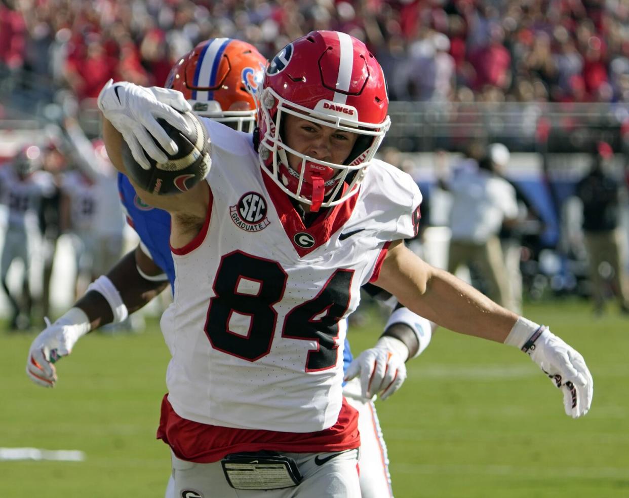 Georgia wide receiver Ladd McConkey (84) crosses the goal line in front of Florida linebacker Scooby Williams.