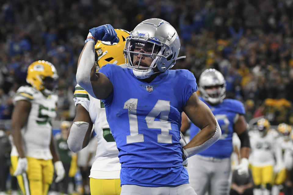 Detroit Lions wide receiver Amon-Ra St. Brown reacts after a 2-yard reception for a touchdown during the first half of an NFL football game against the Green Bay Packers, Sunday, Jan. 9, 2022, in Detroit. (AP Photo/Lon Horwedel)