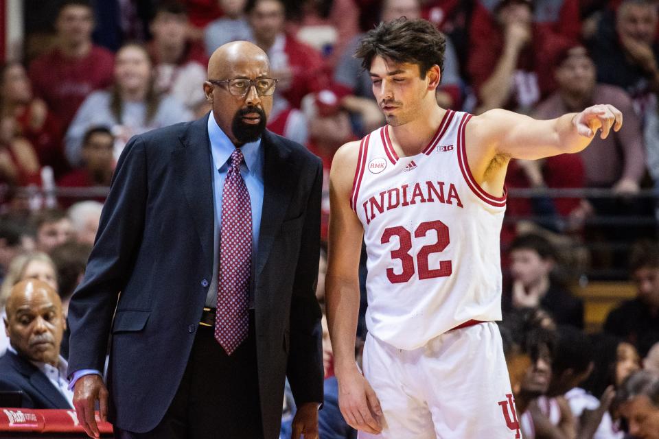 Jan 12, 2024; Bloomington, Indiana, USA; Indiana Hoosiers head coach Mike Woodson and guard Trey Galloway (32) talk in the first half against the Minnesota Golden Gophers at Simon Skjodt Assembly Hall.