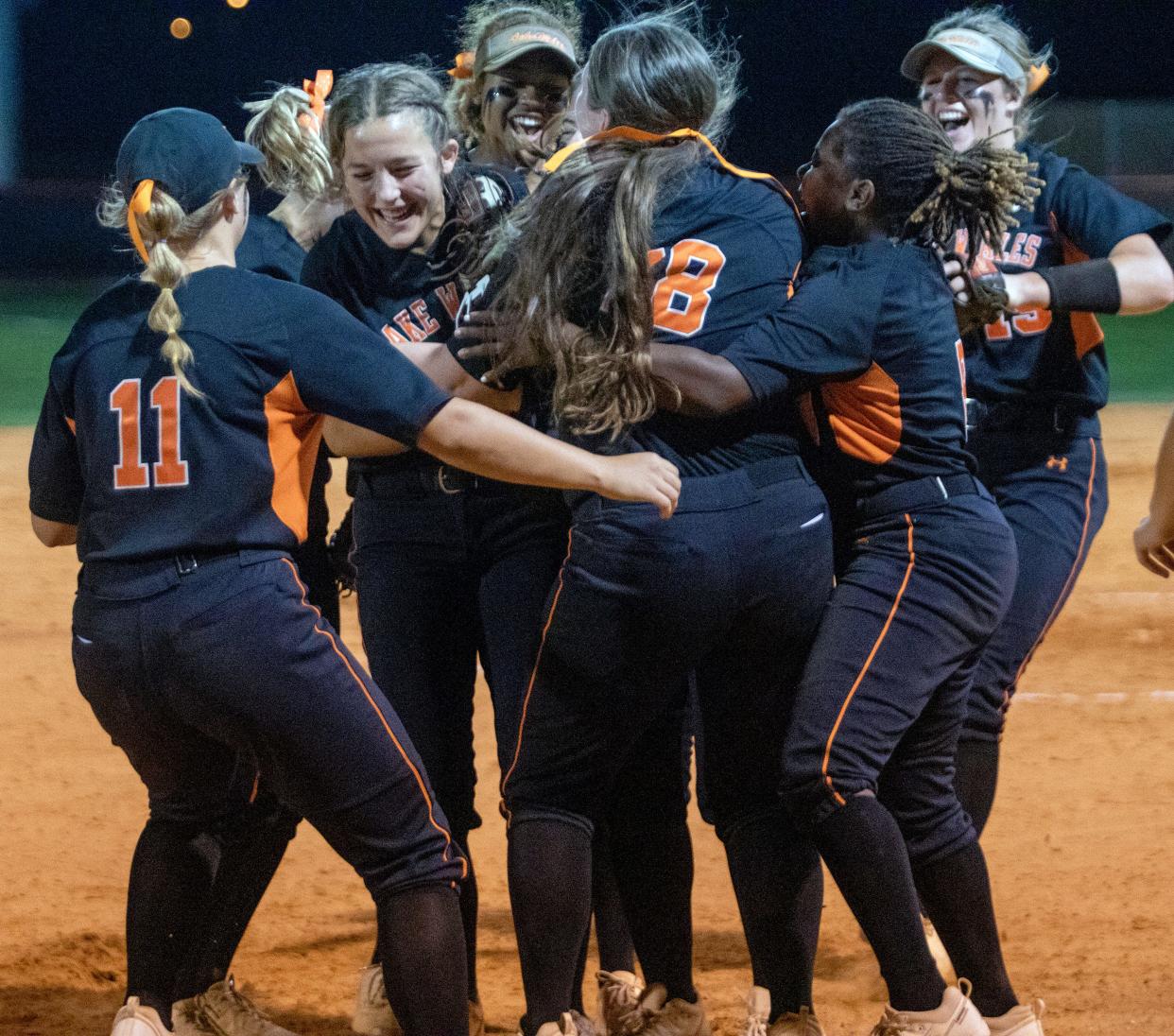 Lake Wales pitcher Macey Murphy celebrates with her teammates after defeating Lake Region, 4-0, on Friday night in the Class 4A, Region 3 final at Lake Wales.