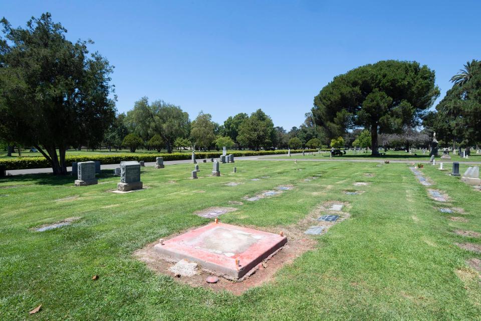 Only the foundation remains from a Confederate monument that was defaced with orange paint in early July 2019 and later removed at Santa Ana Cemetery in Santa Ana, Calif. Relying on hard data, a team of scholars showed a mathematical correlation between elite Confederate settlers and Confederate monuments, lynchings, sundown towns, and racial segregation in the West.