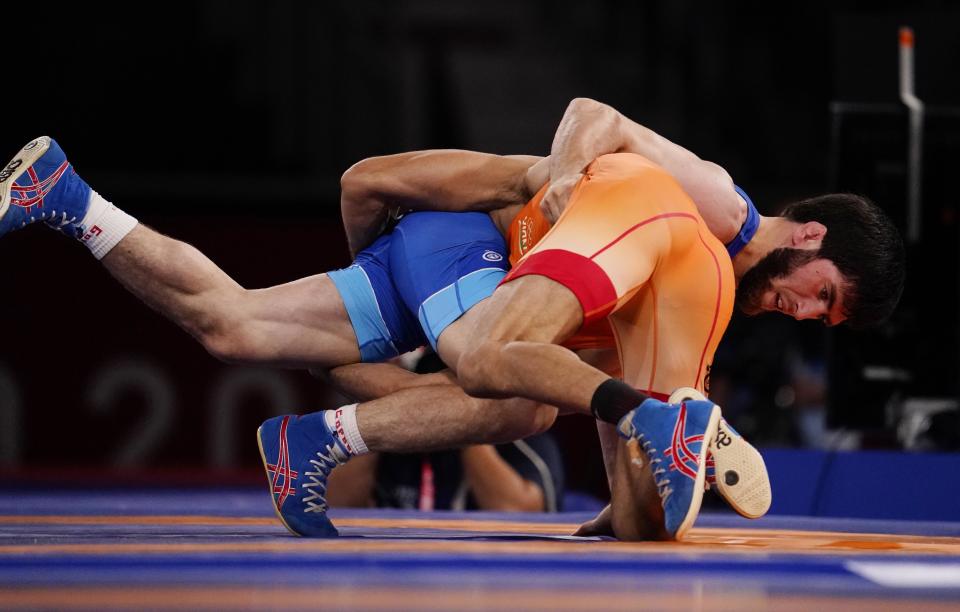 Aug 5, 2021; Chiba, Japan;  Zavur Uguev (ROC) defeats Kumar Ravi (IND) in the men's freestyle 57kg final during the Tokyo 2020 Olympic Summer Games at Makuhari Messe Hall A. Mandatory Credit: Mandi Wright-USA TODAY Sports