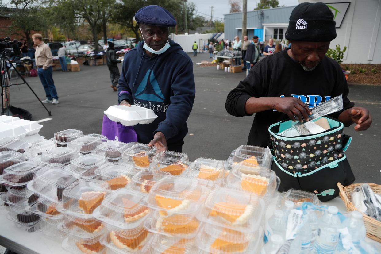 Participants pick out a dessert to go with their Thanksgiving meal on Wednesday at Union Mission Savannah.