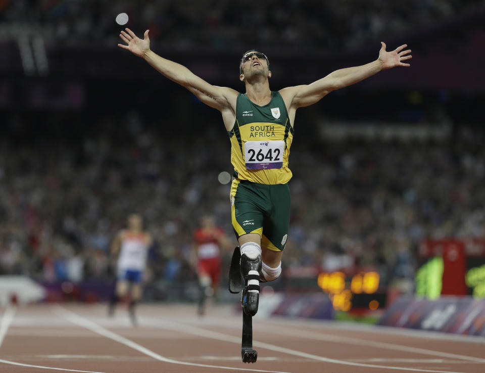 FILE: In this Saturday, Sept. 8, 2012 South Africa's Oscar Pistorius wins gold in the men's 400-meter T44 final at the 2012 Paralympics, in London. Pistorius, now 27, faces possibly being sent to prison until he is older than 50 for the shooting death of his girlfriend Reeva Steenkamp. Pistorius goes on trial Monday March 3, 2014. (AP Photo/Kirsty Wigglesworth-File)