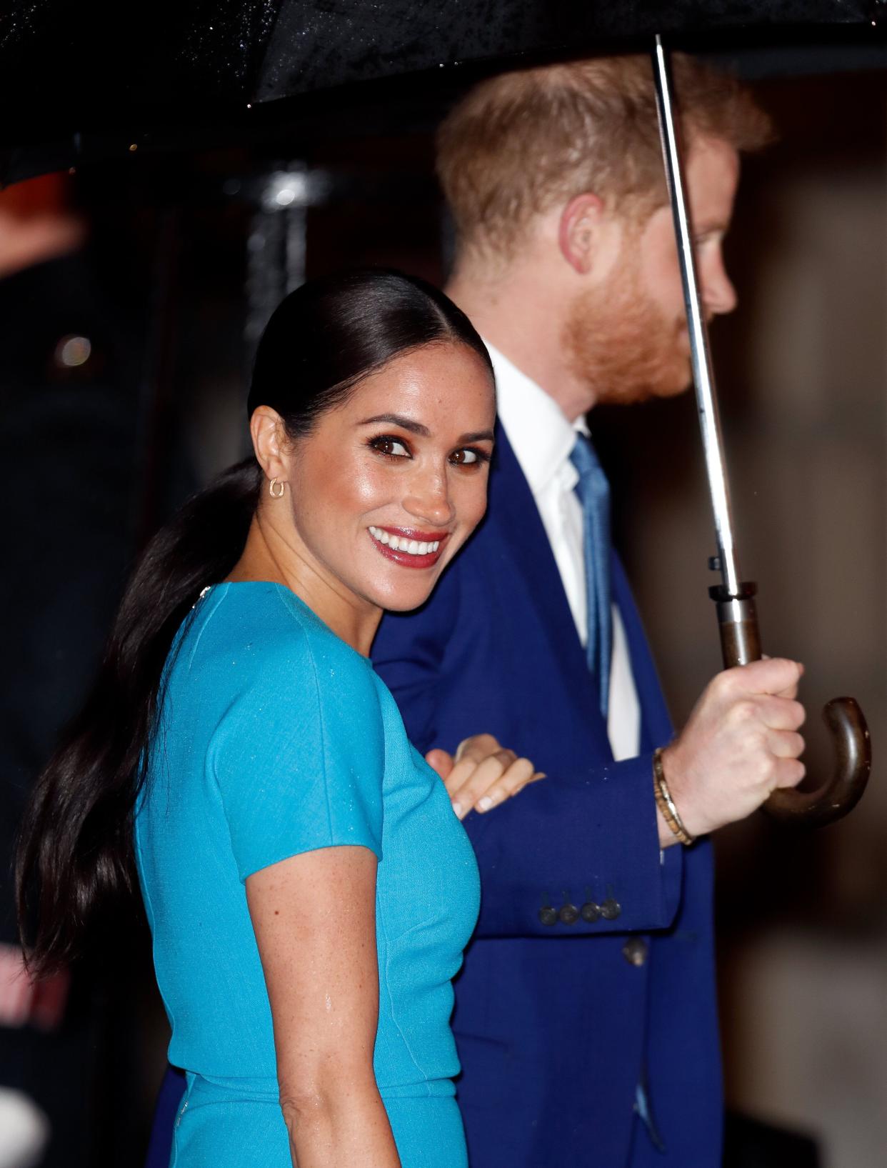 We're willing to bet that Meghan is the only Sussex sporting a ponytail!  (Photo: Max Mumby/Indigo via Getty Images)