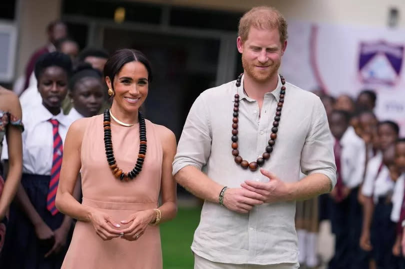 Prince Harry and Meghan visit children at the Lights Academy in Abuja, Nigeria, Friday, May 10, 2024.  Prince Harry and his wife Meghan have arrived in Nigeria to champion the Invictus Games, which he founded to aid the rehabilitation of wounded and sick servicemembers and veterans.