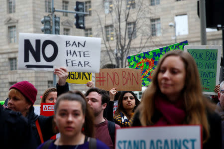 Immigration activists, including members of the DC Justice for Muslims Coalition, rally against the Trump administration's new ban against travelers from six Muslim-majority nations, outside of the U.S. Customs and Border Protection headquarters in Washington, U.S., March 7, 2017. REUTERS/Eric Thayer