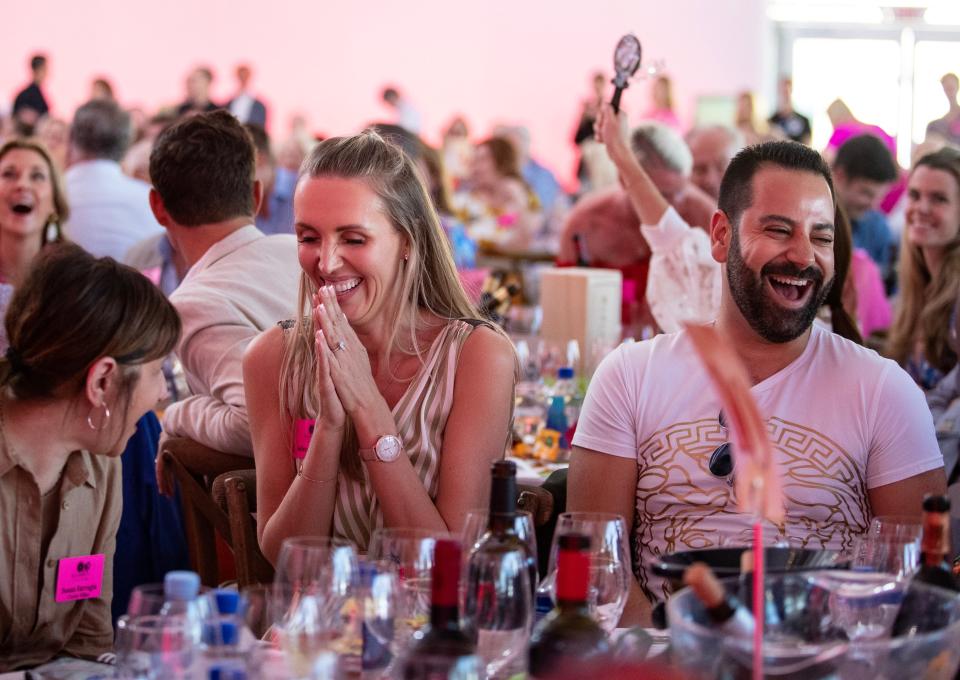 Jelena Madzar laughs as she is deciding whether to up her bid on lot 10: Cruising the Islands of Croatia at the Naples Winter Wine Festival on Saturday, Jan. 27, 2024, at the Ritz Carlton Golf Resort in Naples. Madzar was outbid.