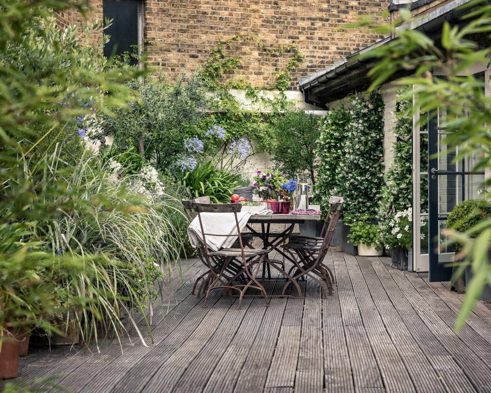 Surround a decked courtyard with plants