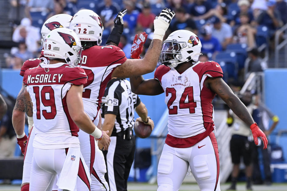 Arizona Cardinals running back Darrel Williams (24) is congratulated after scoring a touchdown against the Tennessee Titans in the first half of a preseason NFL football game Saturday, Aug. 27, 2022, in Nashville, Tenn. (AP Photo/Mark Zaleski)