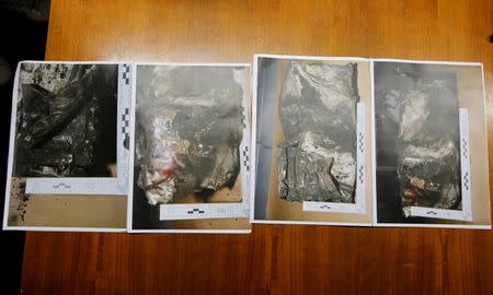 Four pictures showing the damaged black box data flight recorder are seen during a press conference given by French prosecutor of Marseille, Brice Robin (not pictured), in Marseille April 2, 2015. REUTERS/Jean-Paul Pelissier