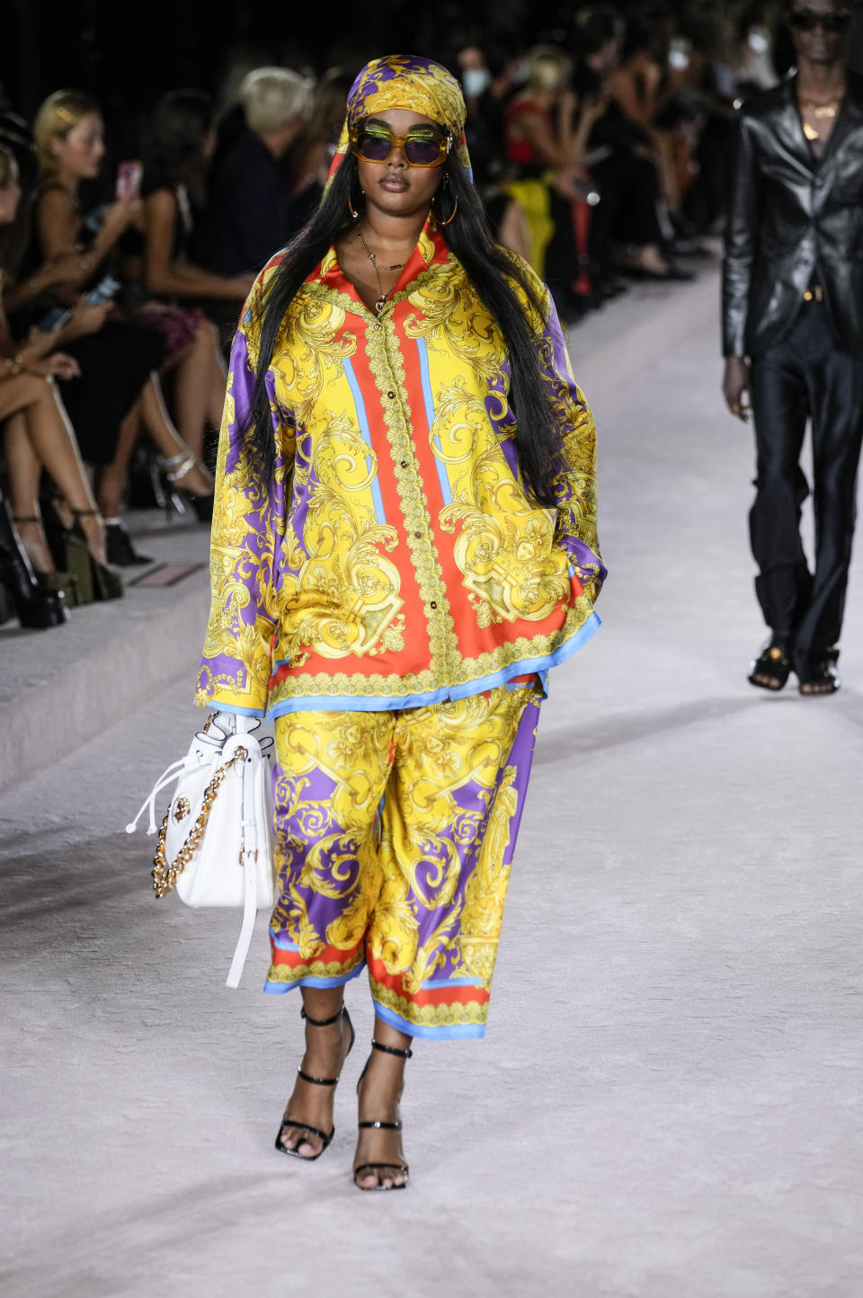 A model wears a creation for the Versace Spring Summer 2022 collection during Milan Fashion Week, in Milan, Italy, Friday, Sept. 24, 2021. (AP Photo/Luca Bruno)