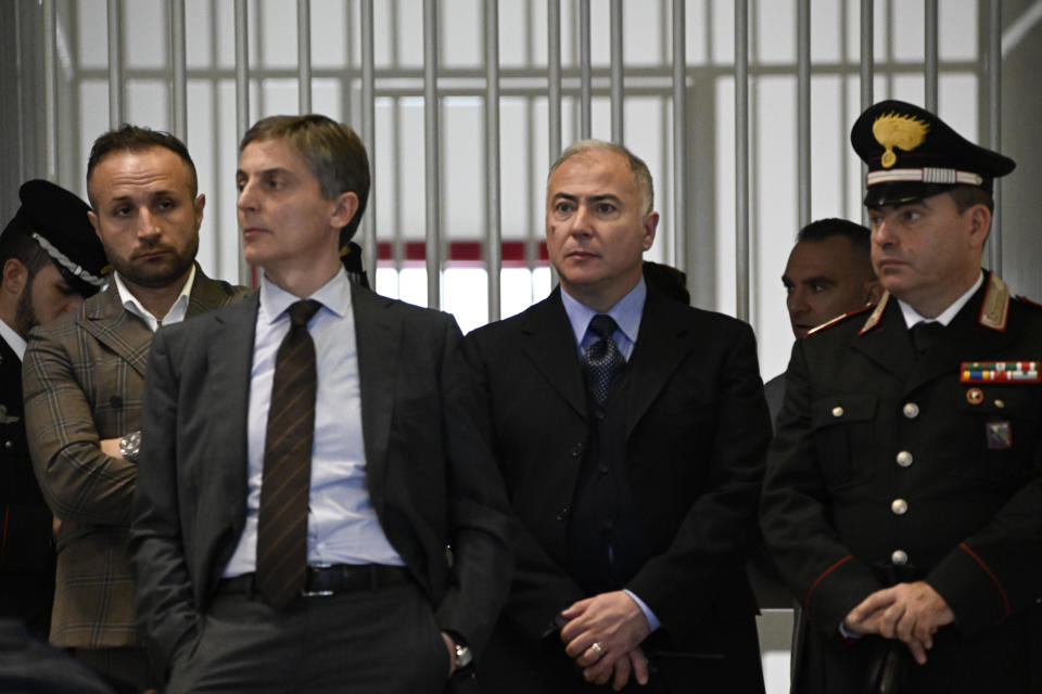 Officials listen as judges read the verdicts of a maxi-trial of hundreds of people accused of membership in Italy's 'ndrangheta organized crime syndicate, one of the world's most powerful, extensive and wealthy drug-trafficking groups, in Lamezia Terme, southern Italy, Monday, Nov. 20, 2023. Verdicts are expected Monday for the trial that started almost three years ago in the southern Calabria region, where the mob organization was originally based. (AP Photo/Valeria Ferraro)