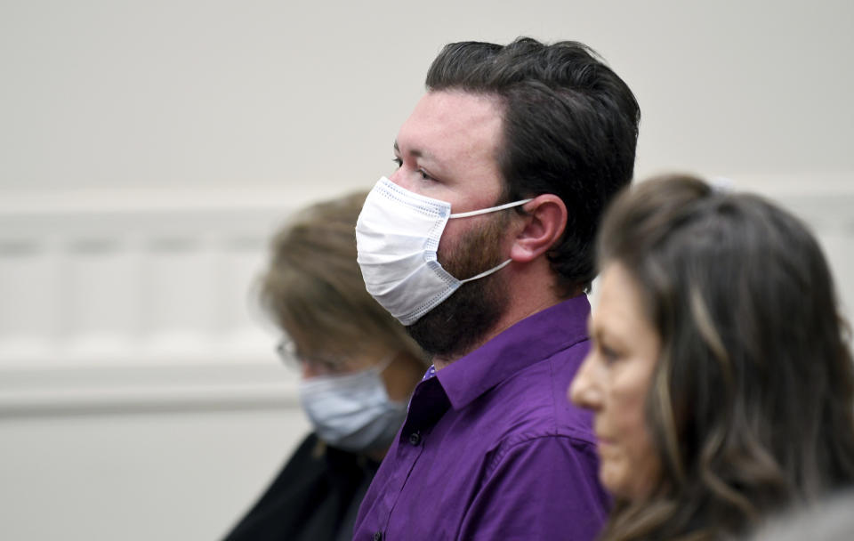 Miles Harford appears in court to hear the charges against him on Friday, March 8, 2024, in Denver. Harford, a former funeral home owner accused of keeping a woman's corpse in the back of a hearse for two years and hoarding the cremated remains of 35 people, has been charged with forgery, theft and abuse of a corpse. (AP Photo/Thomas Peipert, Pool)