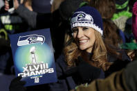 A Seattle Seahawks fan holds up a sign during the Super Bowl champions parade on Wednesday, Feb. 5, 2014, in Seattle. The Seahawks beat the Denver Broncos 43-8 in NFL football's Super Bowl XLVIII on Sunday. (AP Photo/Ted S. Warren)