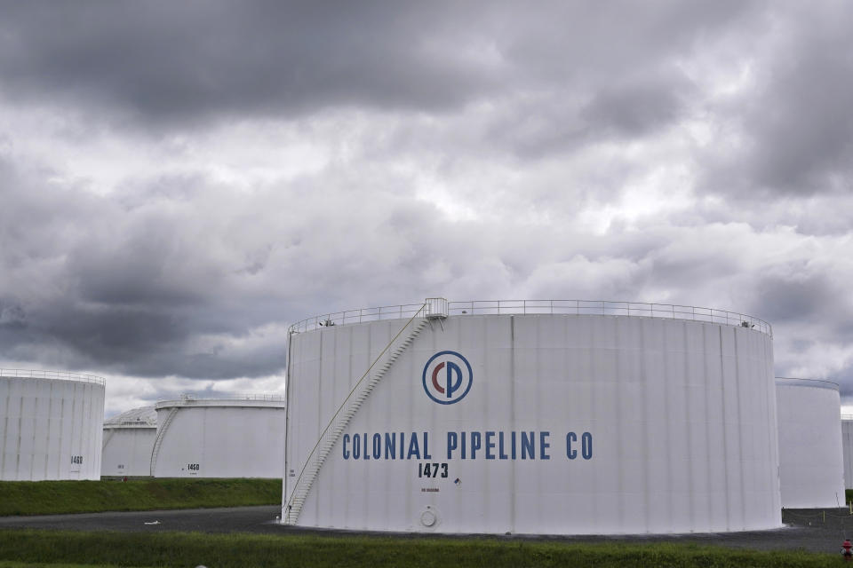 Colonial Pipeline storage tanks are seen in Woodbridge, N.J., Monday, May 10, 2021. Gasoline futures are ticking higher following a cyberextortion attempt on the Colonial Pipeline, a vital U.S. pipeline that carries fuel from the Gulf Coast to the Northeast. (AP Photo/Seth Wenig)