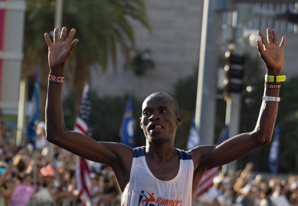 George Onyancha, 28, crosses the line as the first person to finish the full marathon during the Life Time Miami Marathon and Half on Sunday, Jan. 28, 2024, finishing at Bayfront Park in downtown Miami. Alie Skowronski/askowronski@miamiherald.com