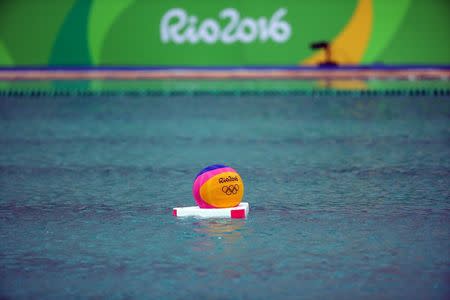 2016 Rio Olympics - Water Polo - Preliminary - Men's Preliminary Round - Group A Australia v Japan - Maria Lenk Aquatics Centre - Rio de Janeiro, Brazil - 10/08/2016. A ball is seen in the pool where the water turned green. REUTERS/Kai Pfaffenbach