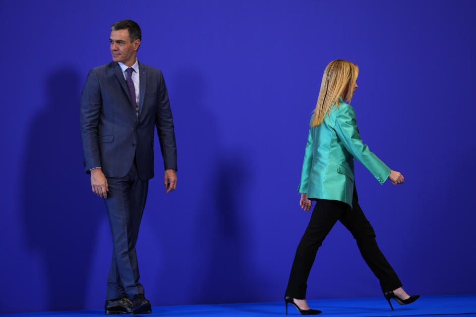 Italy's Prime Minister Giorgia Meloni walks after meeting Spain's acting Prime Minister Pedro Sanchez on arrival for the second day of the Europe Summit in Granada, Spain, Friday, Oct. 6, 2023. European Union leaders have pledged Ukrainian President Volodymyr Zelenskyy their unwavering support. On Friday, they will face one of their worst political headaches on a key commitment. How and when to welcome debt-laden and war-battered Ukraine into the bloc. (AP Photo/Manu Fernandez)